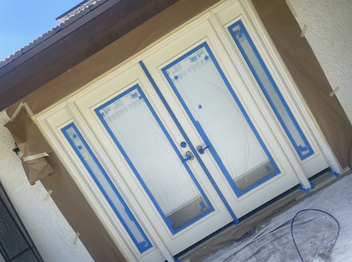 Front double doors masked and taped before refinishing